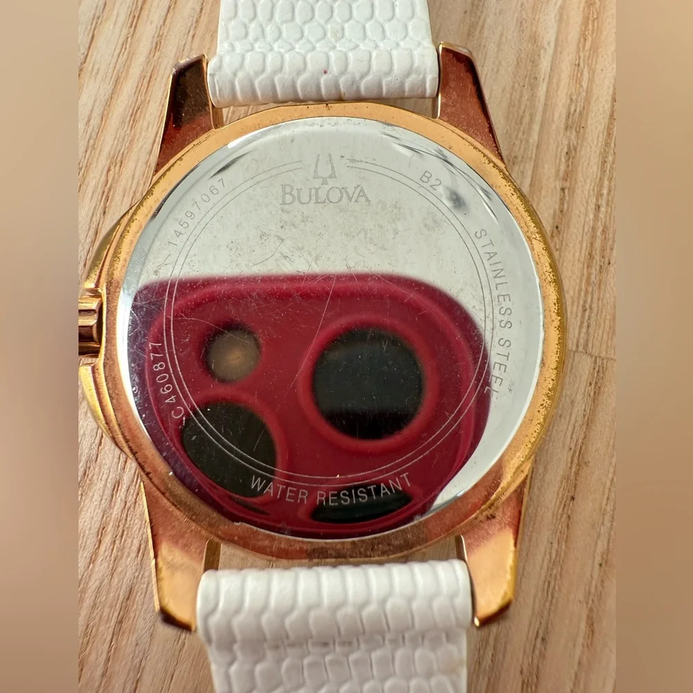 Bulova ladies 98P119 rose gold tone white leather watch NEW BATTERY